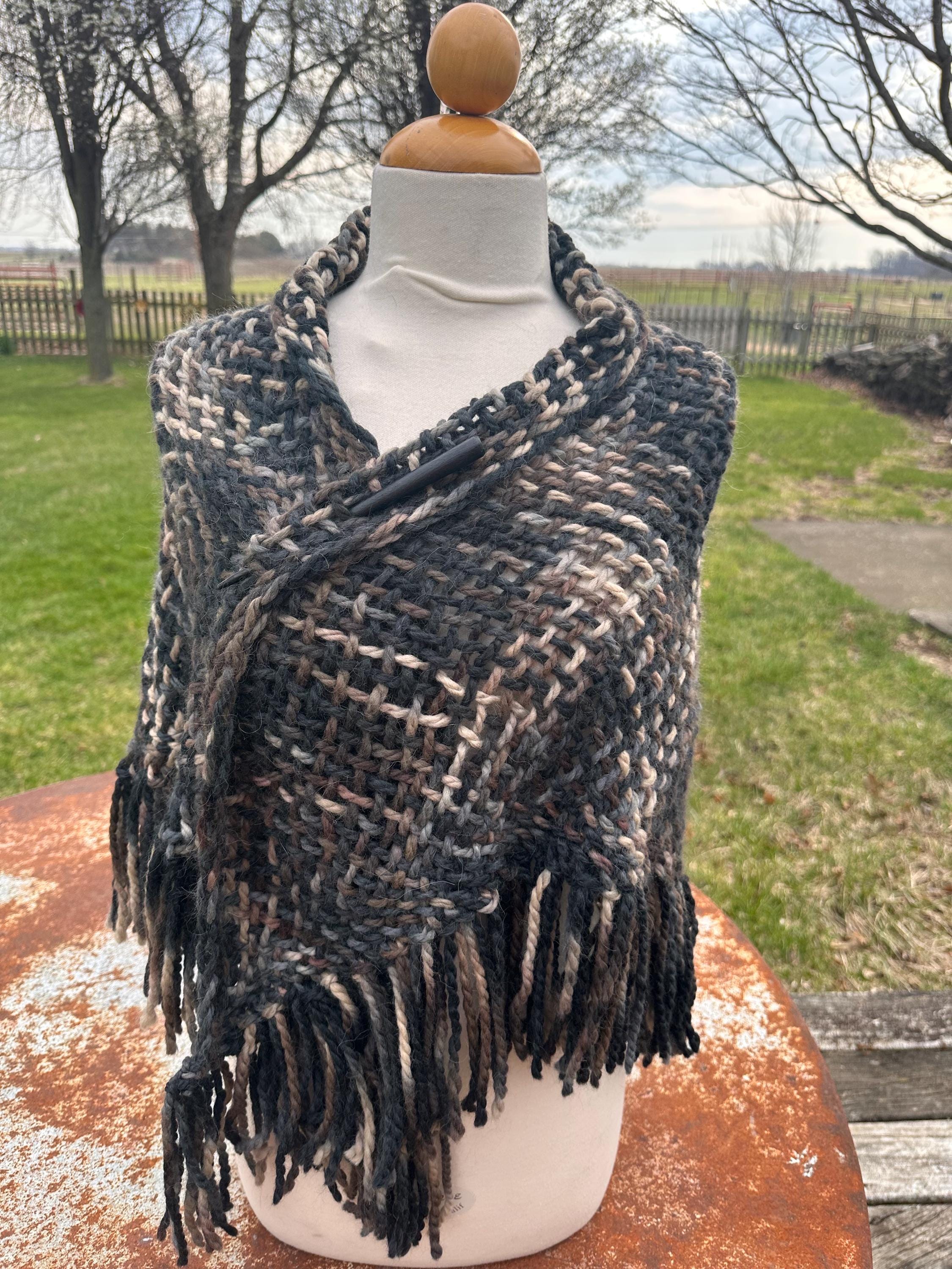 100% Alpaca hand woven shawl with fringe. Very soft and warm