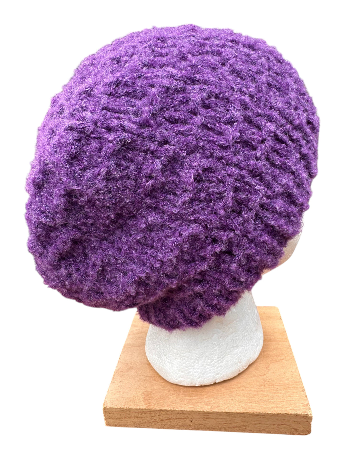 Oak Crest Alpacas and More hand-knit purple boucle alpaca blend hat with a textured, cozy design.