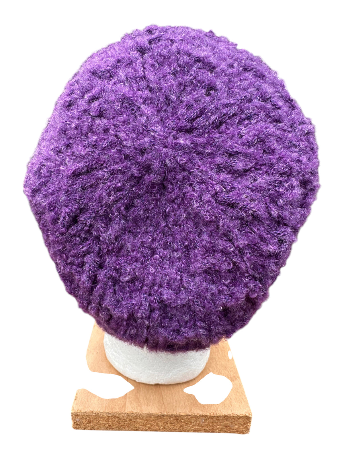 Oak Crest Alpacas and More hand-knit purple boucle alpaca blend hat with textured finish on a display stand