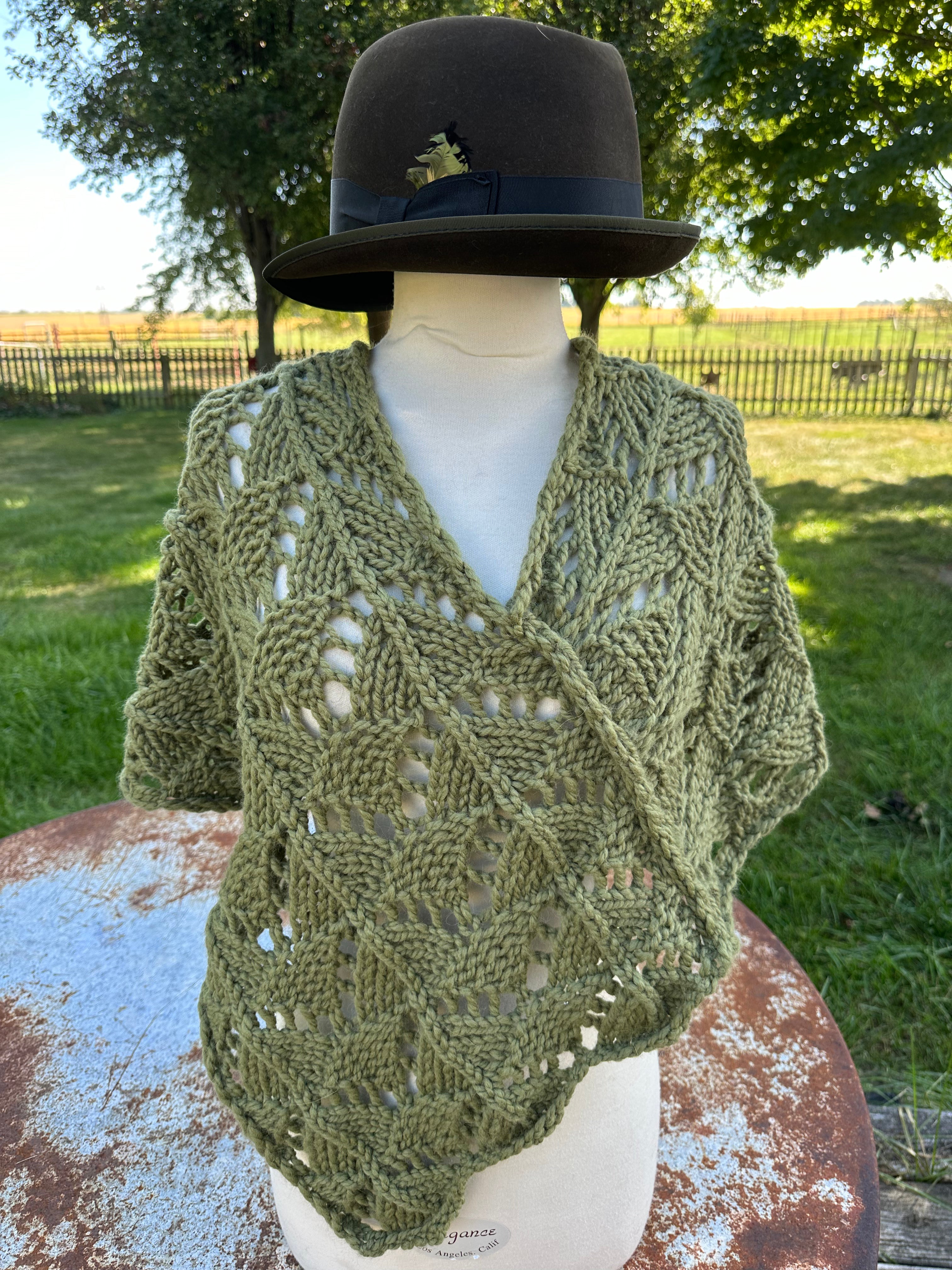 Hand knit Llama poncho/wrap. One size fits all.