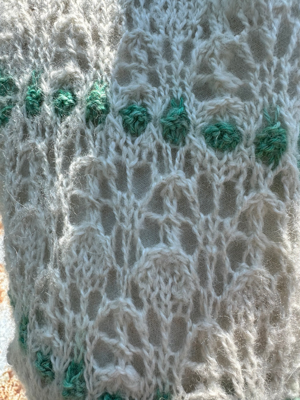 100% USA Alpaca hand knit scarf. Delicate lacey pattern.