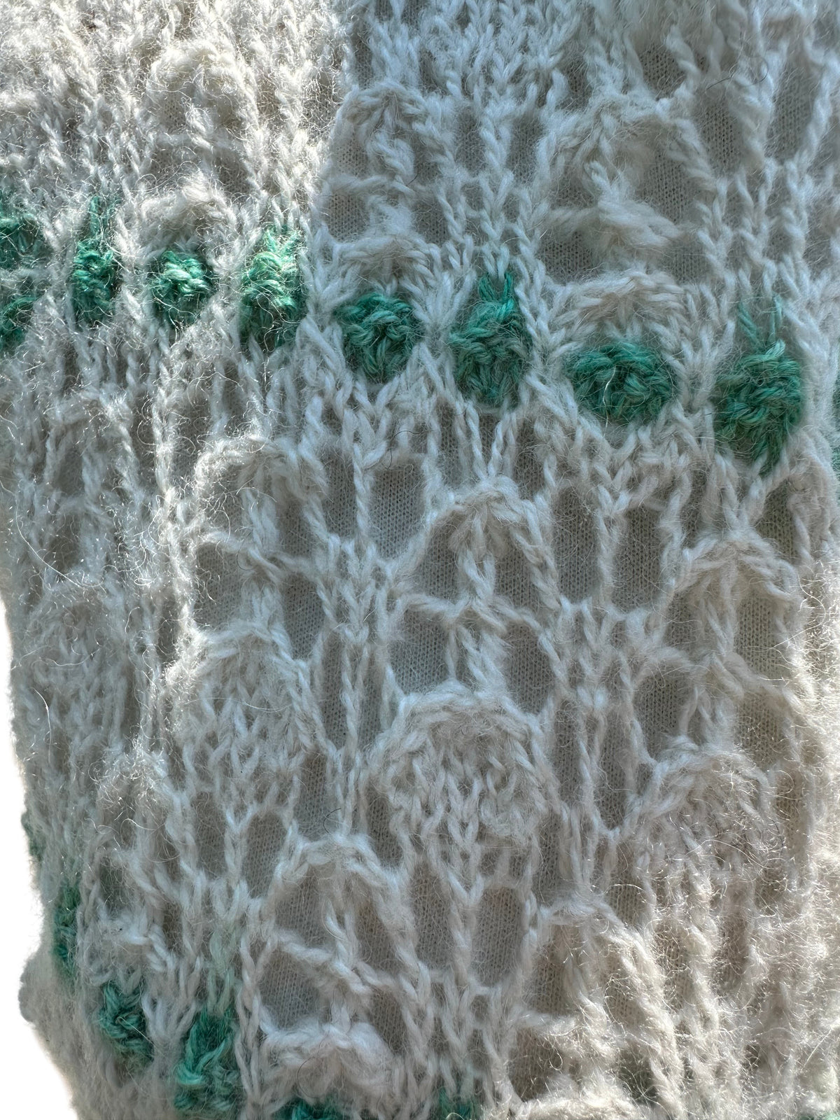 Oak Crest Alpacas and More hand knit white and green lace alpaca scarf with a soft, silky texture.