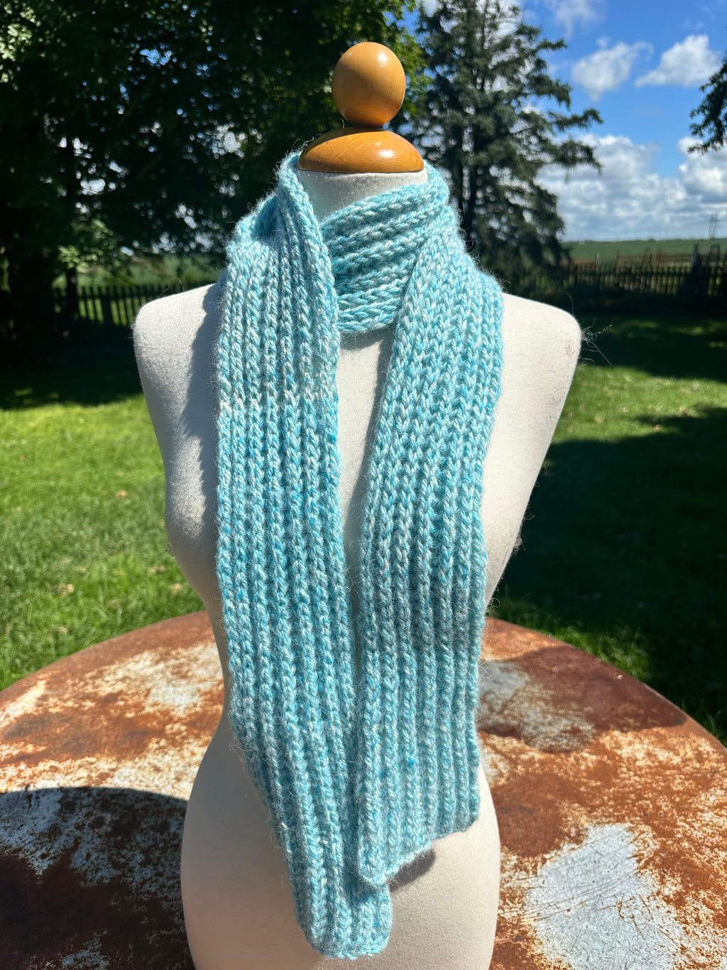 100% USA Alpaca hand knit scarf. Very soft and warm.