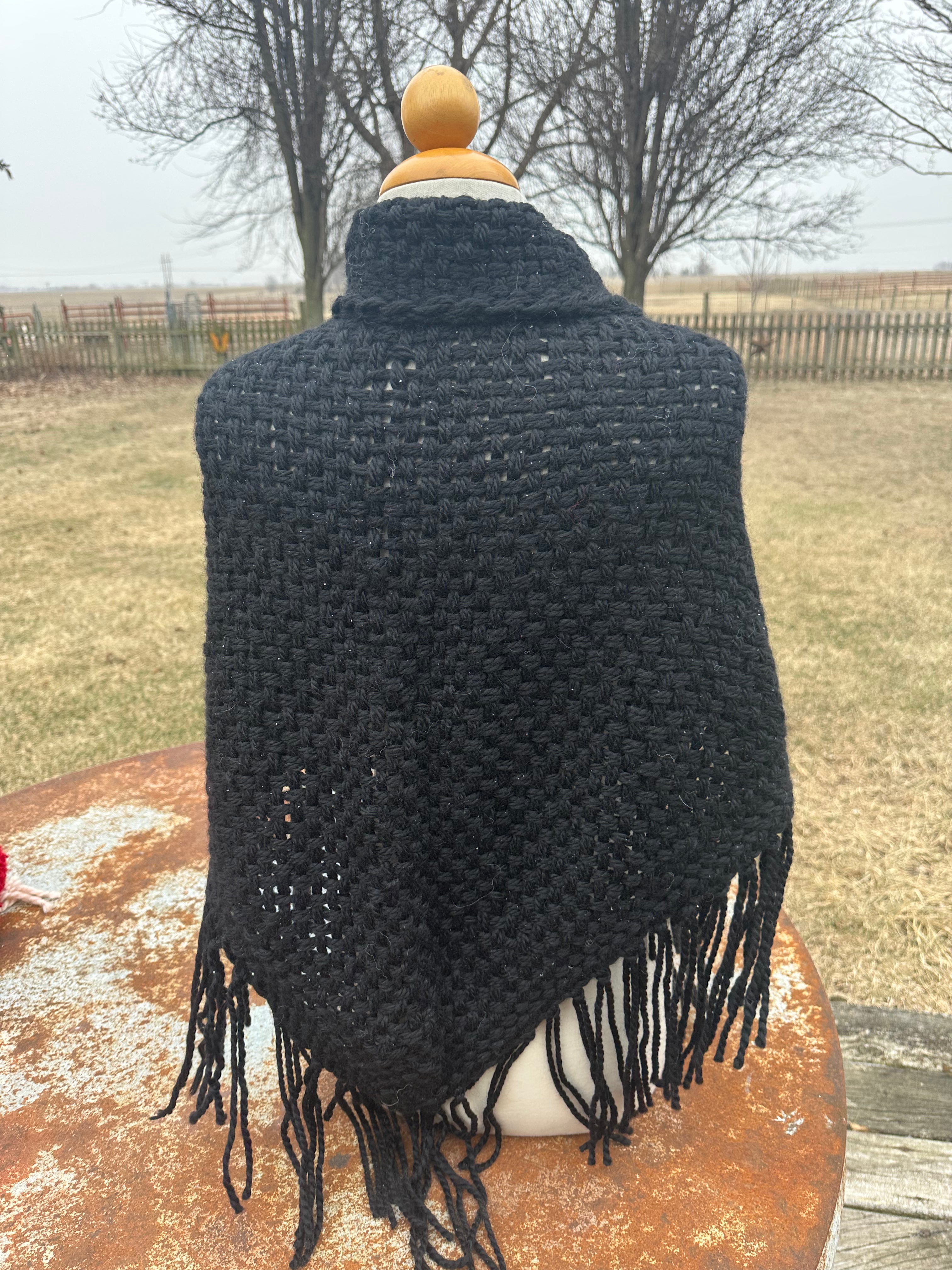 100% Alpaca hand woven shawl with fringe. Very soft and warm.