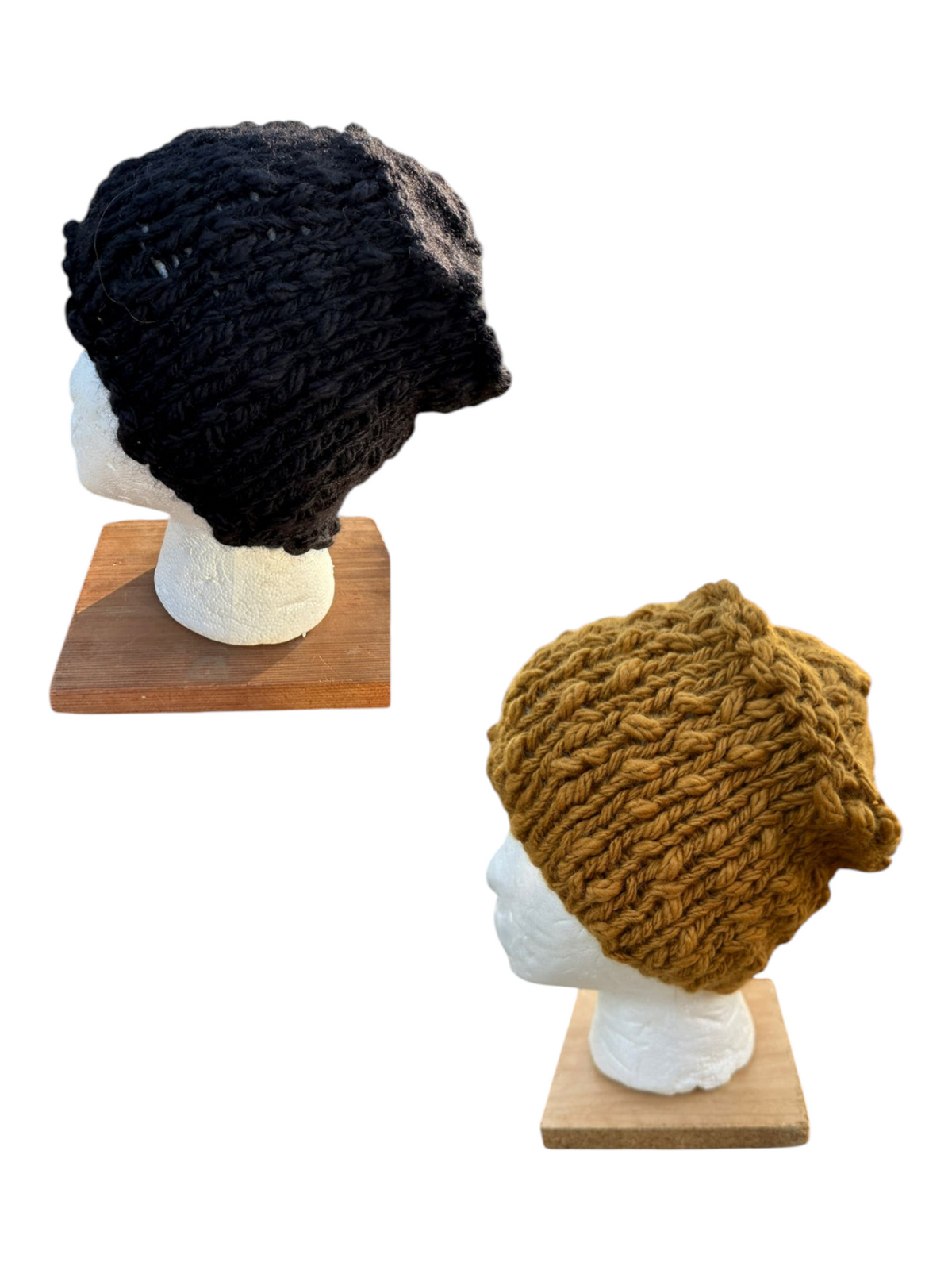 Oak Crest Alpacas and More hand-knit chunky alpaca and wool hats in black and gold on mannequin heads.
