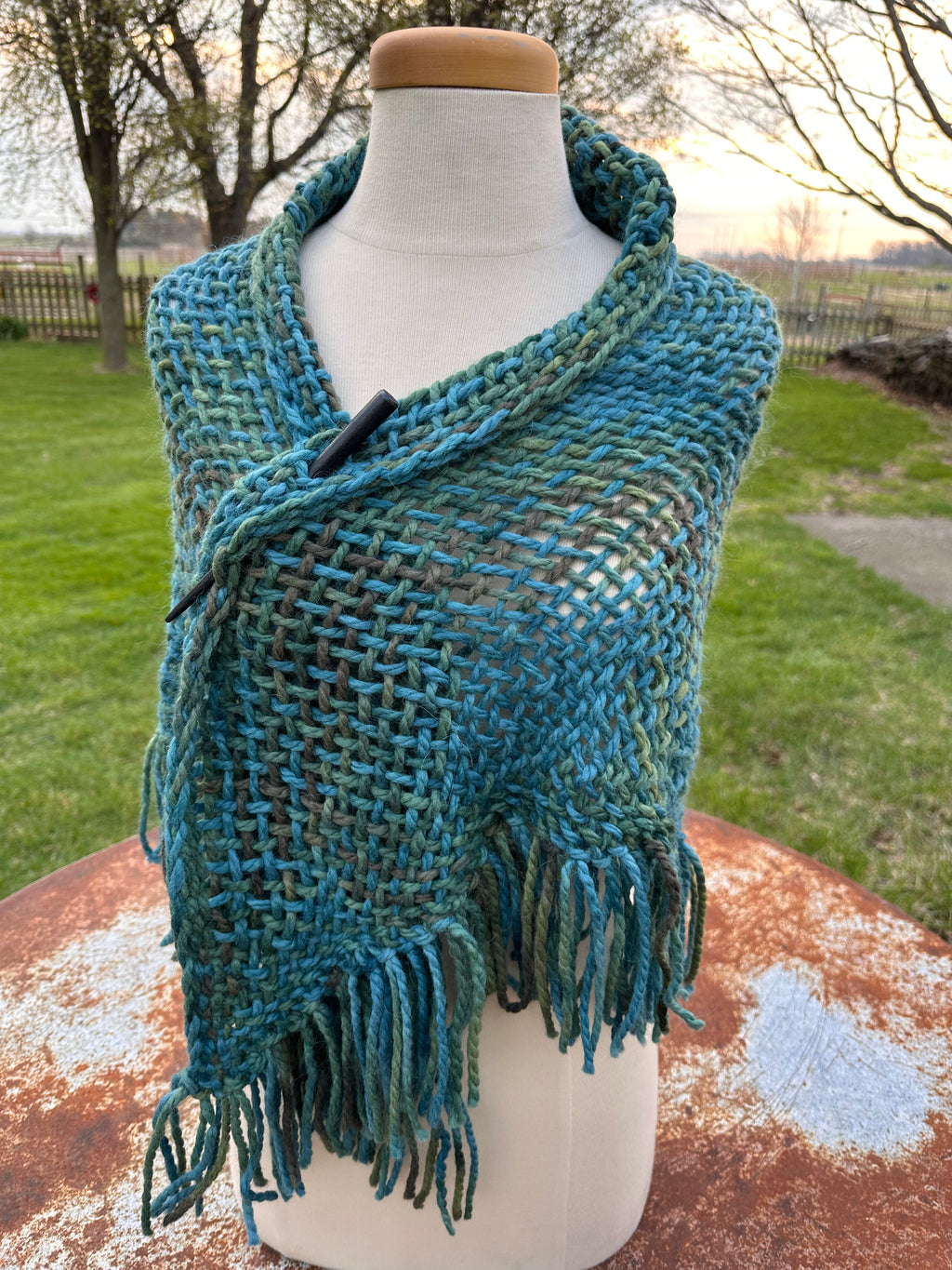 100% Alpaca hand woven shawl with fringe. Very soft and warm.
