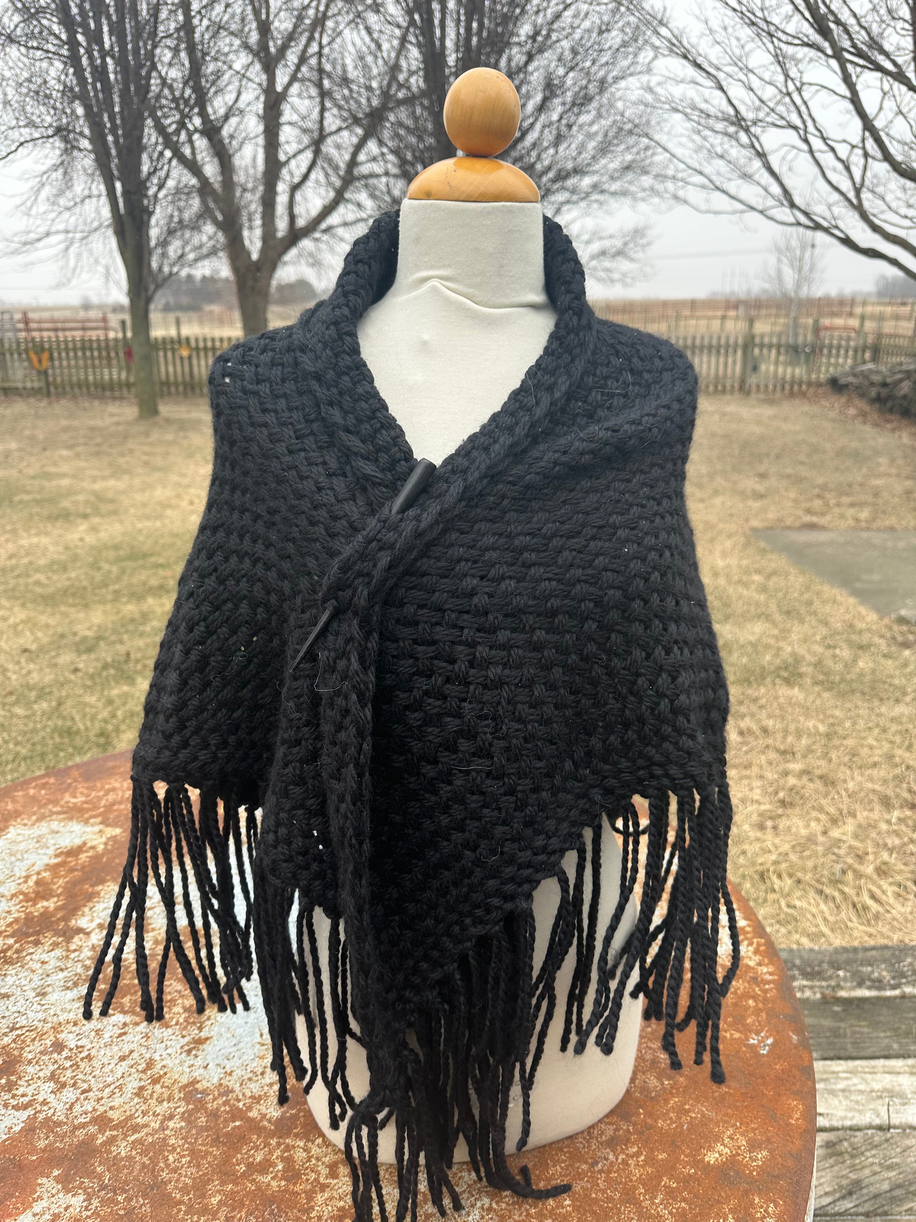 100% Alpaca hand woven shawl with fringe. Very soft and warm.