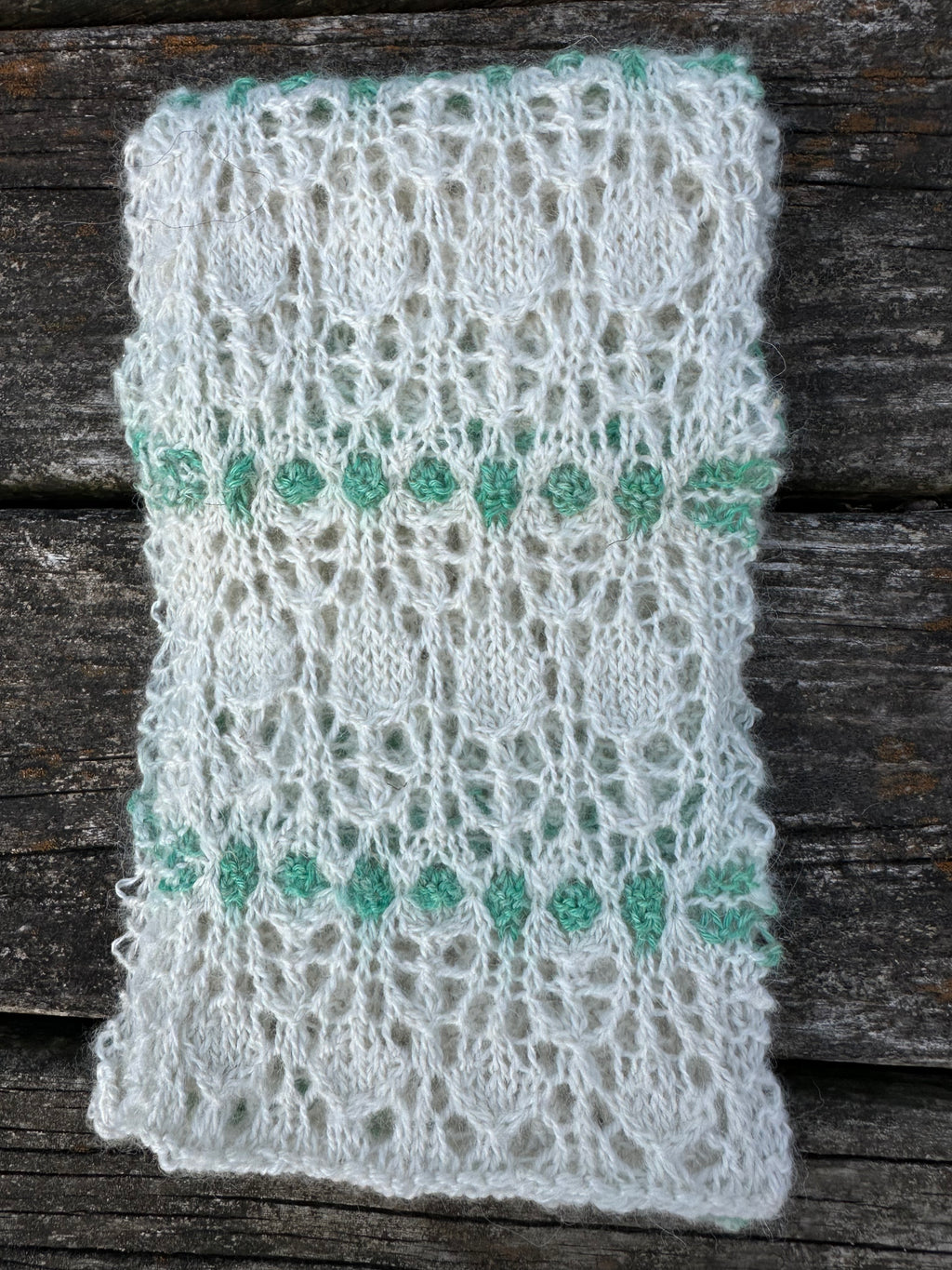 100% USA Alpaca hand knit scarf. Delicate lacey pattern.