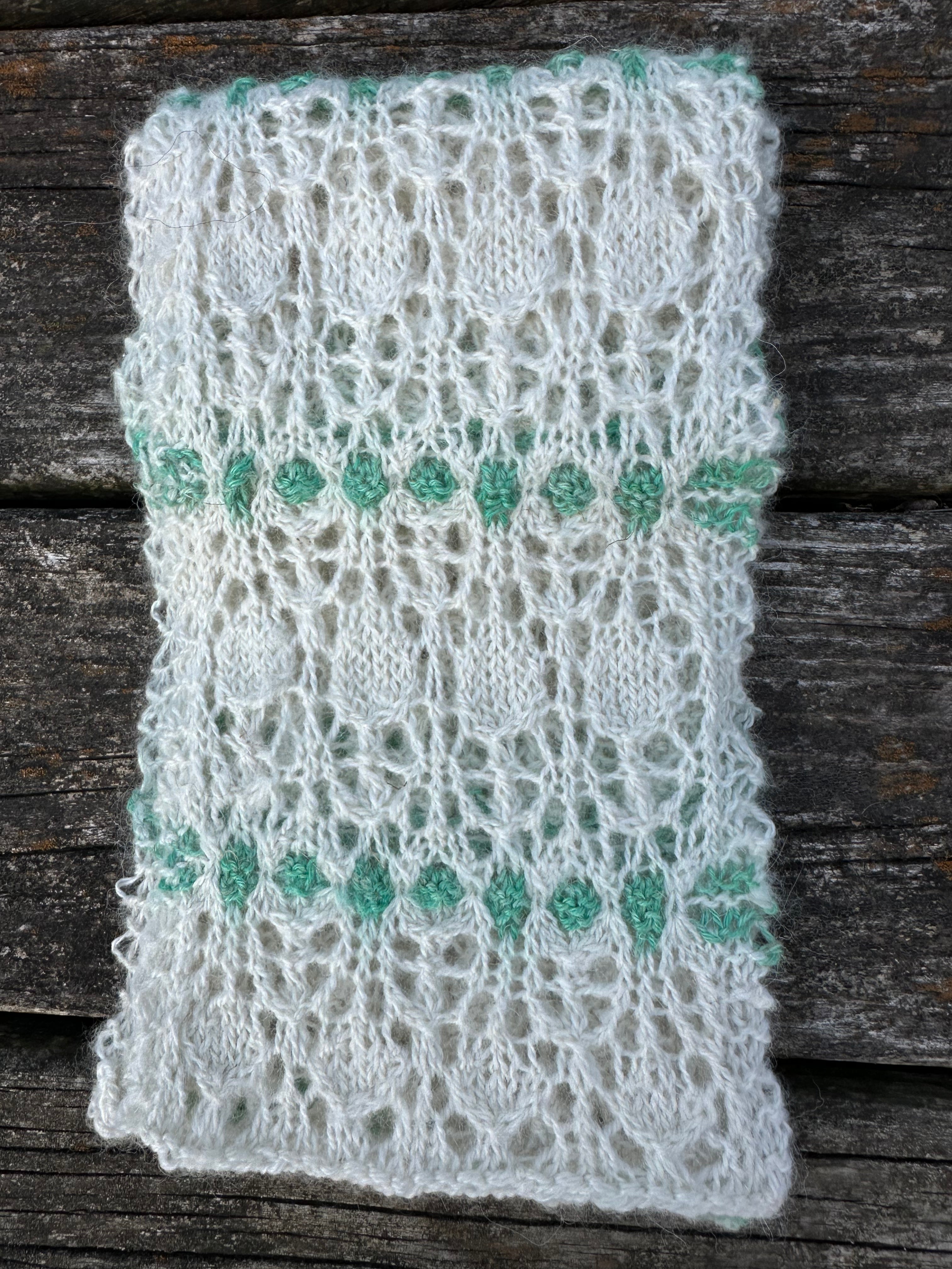 100% USA Alpaca hand knit scarf. Delicate lacey pattern.