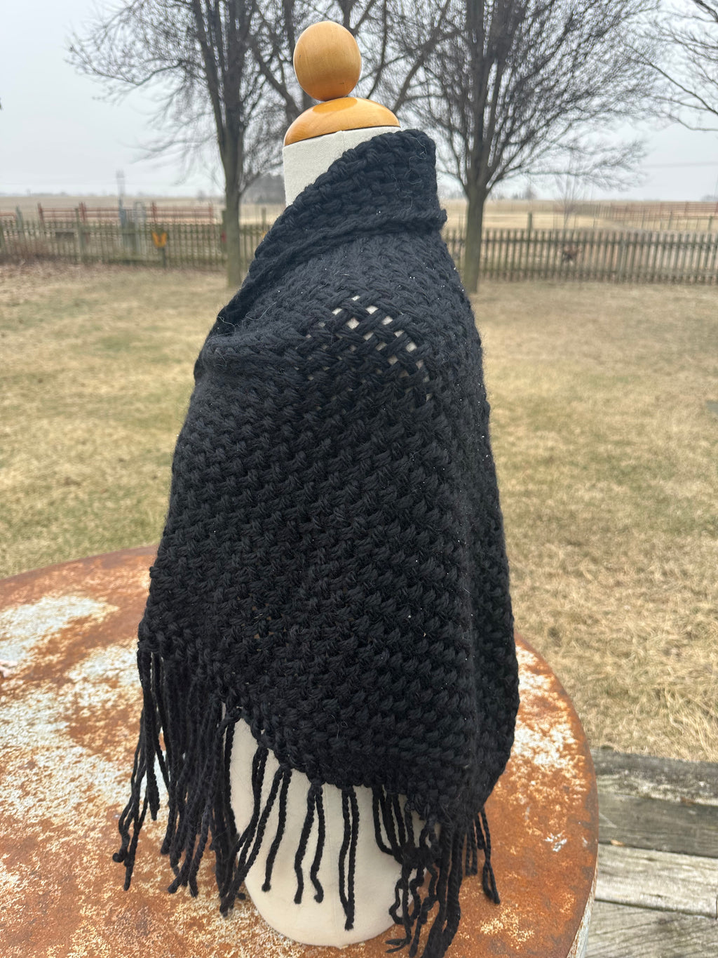 100% Alpaca hand woven shawl with fringe. Very soft and warm.