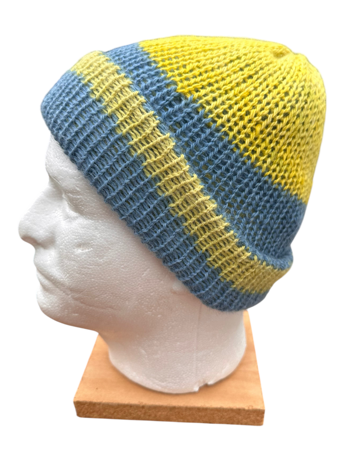 Oak Crest Alpacas and More double knit 100% alpaca hat in yellow and blue stripes on a mannequin head
