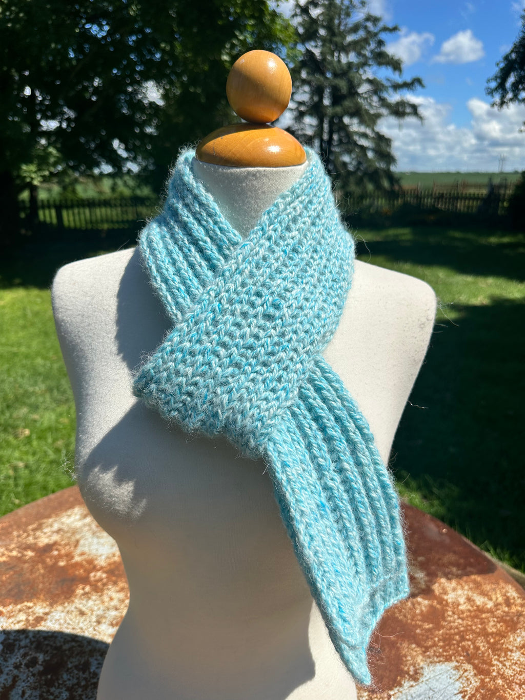 100% USA Alpaca hand knit scarf. Very soft and warm.