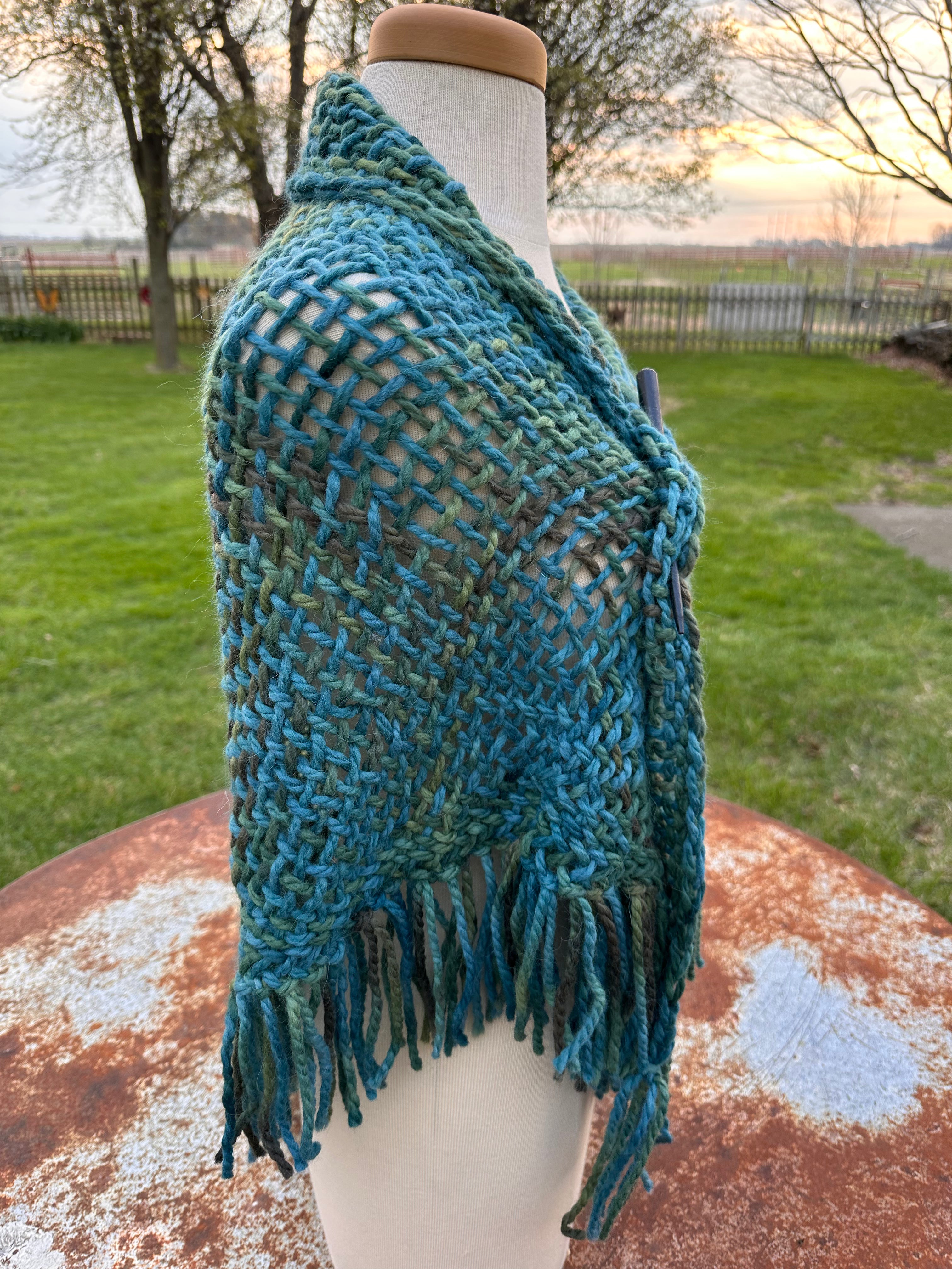 100% Alpaca hand woven shawl with fringe. Very soft and warm.