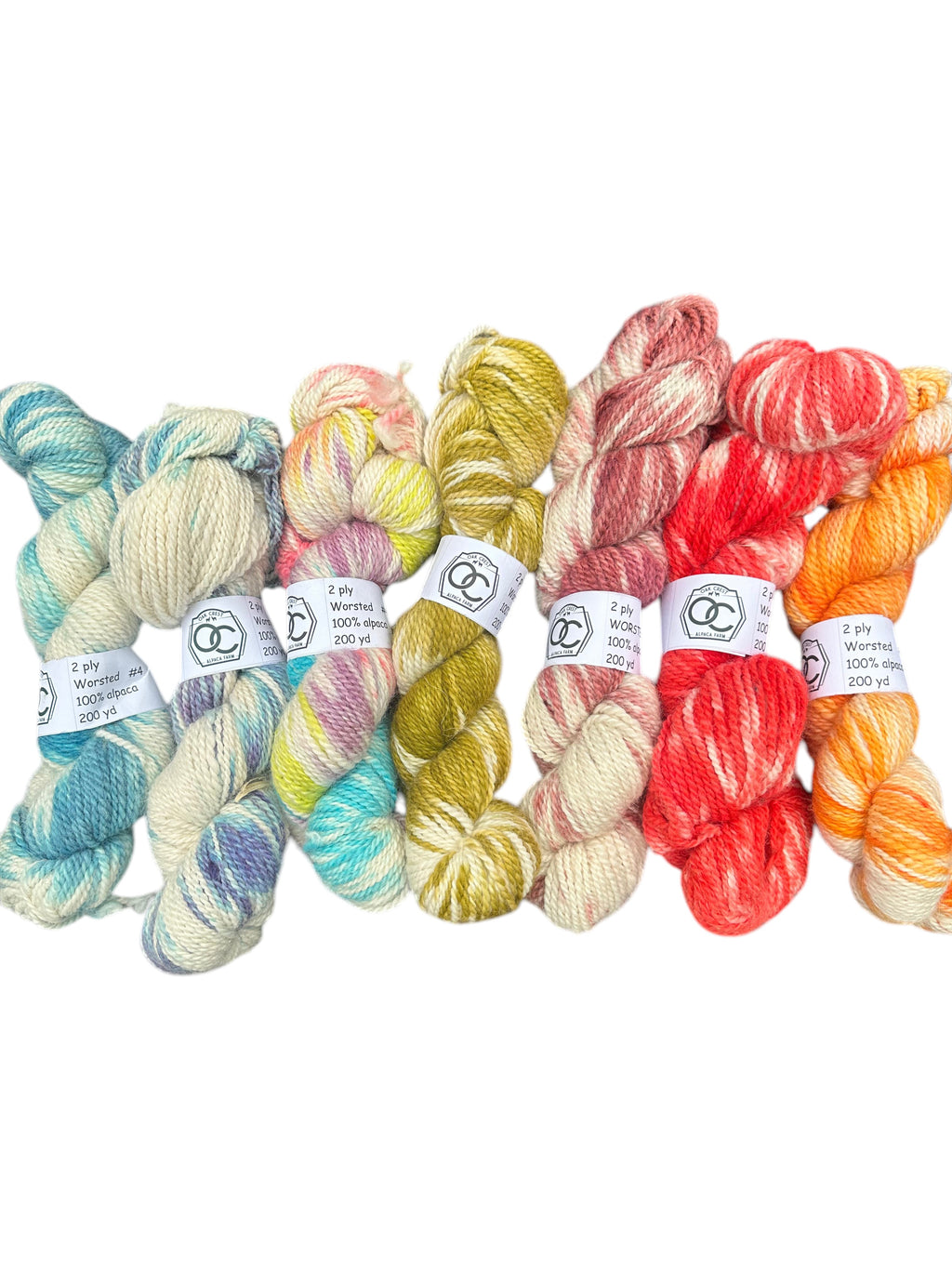 Oak Crest Alpacas and More variegated hand-dyed 100% alpaca worsted yarn skeins in a variety of bright colors