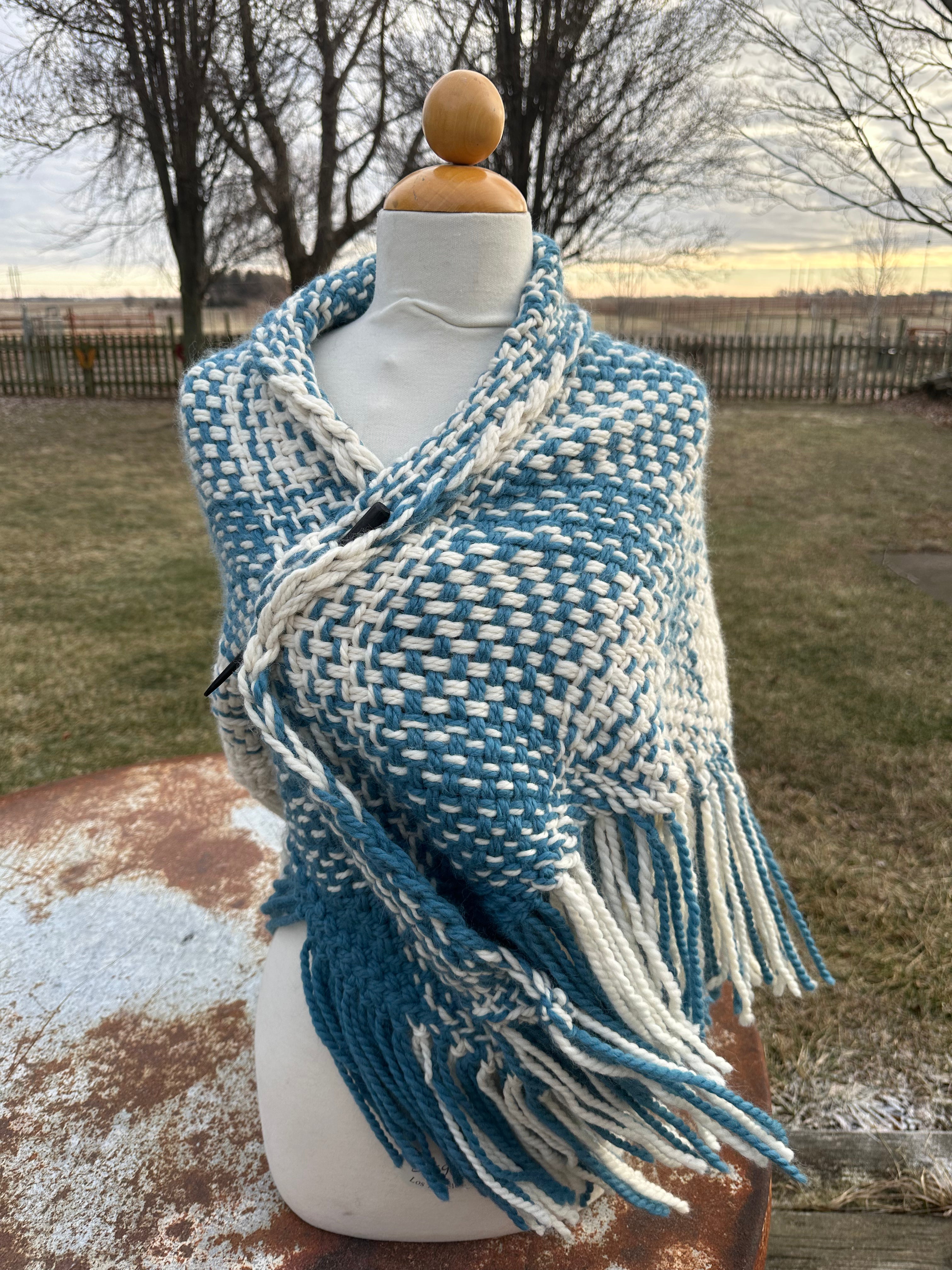 100% Alpaca hand woven shawl with fringe. Very soft and warm.