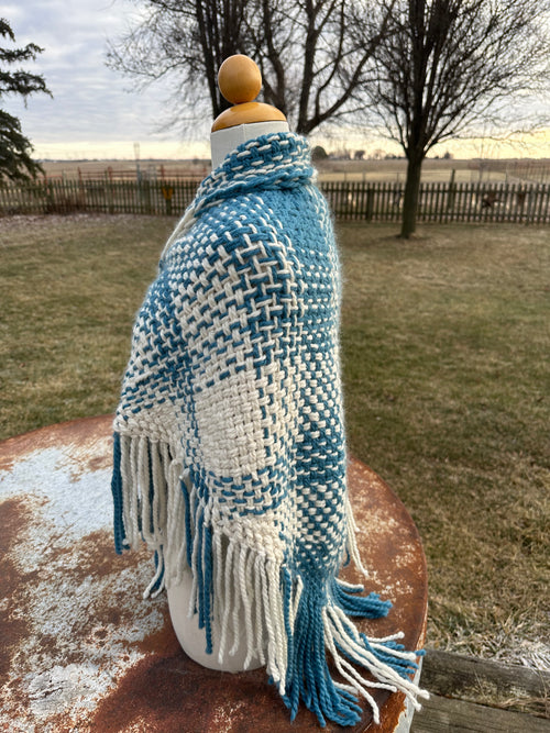 100% Alpaca hand woven shawl with fringe. Very soft and warm.