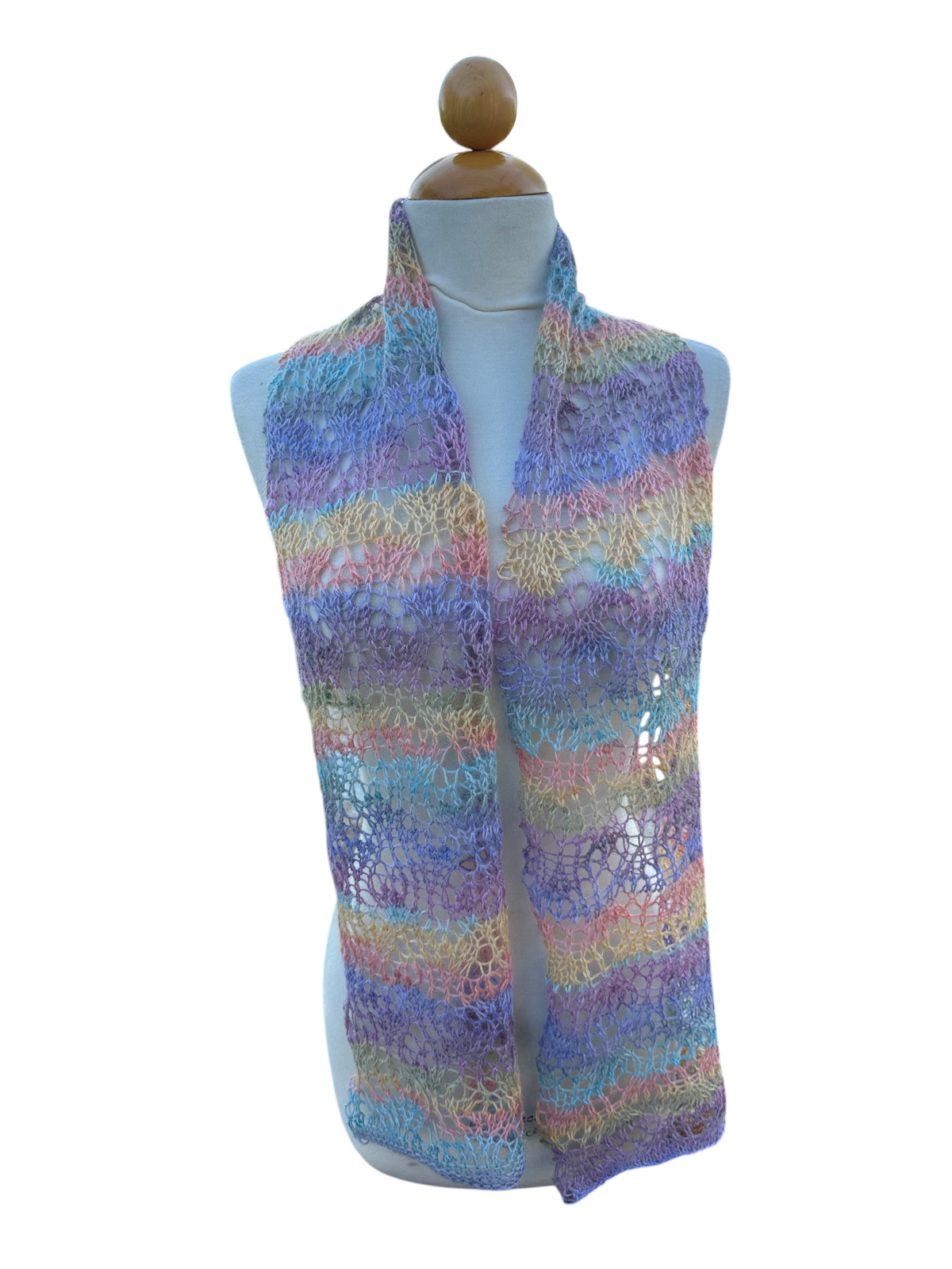 Oak Crest Alpacas and More hand knit lacey pastel alpaca scarf on a mannequin in a garden setting