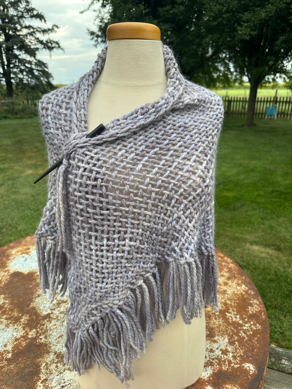100% Alpaca hand woven shawl with fringe. Very soft and warm.