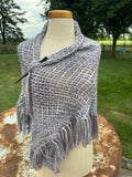 100% Alpaca hand woven shawl with fringe. Very soft and warm.