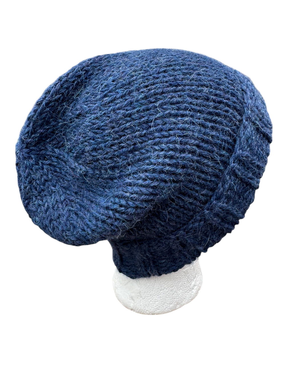 Oak Crest Alpacas and More chunky blue hand-knit alpaca winter hat styled as a slouchy beanie