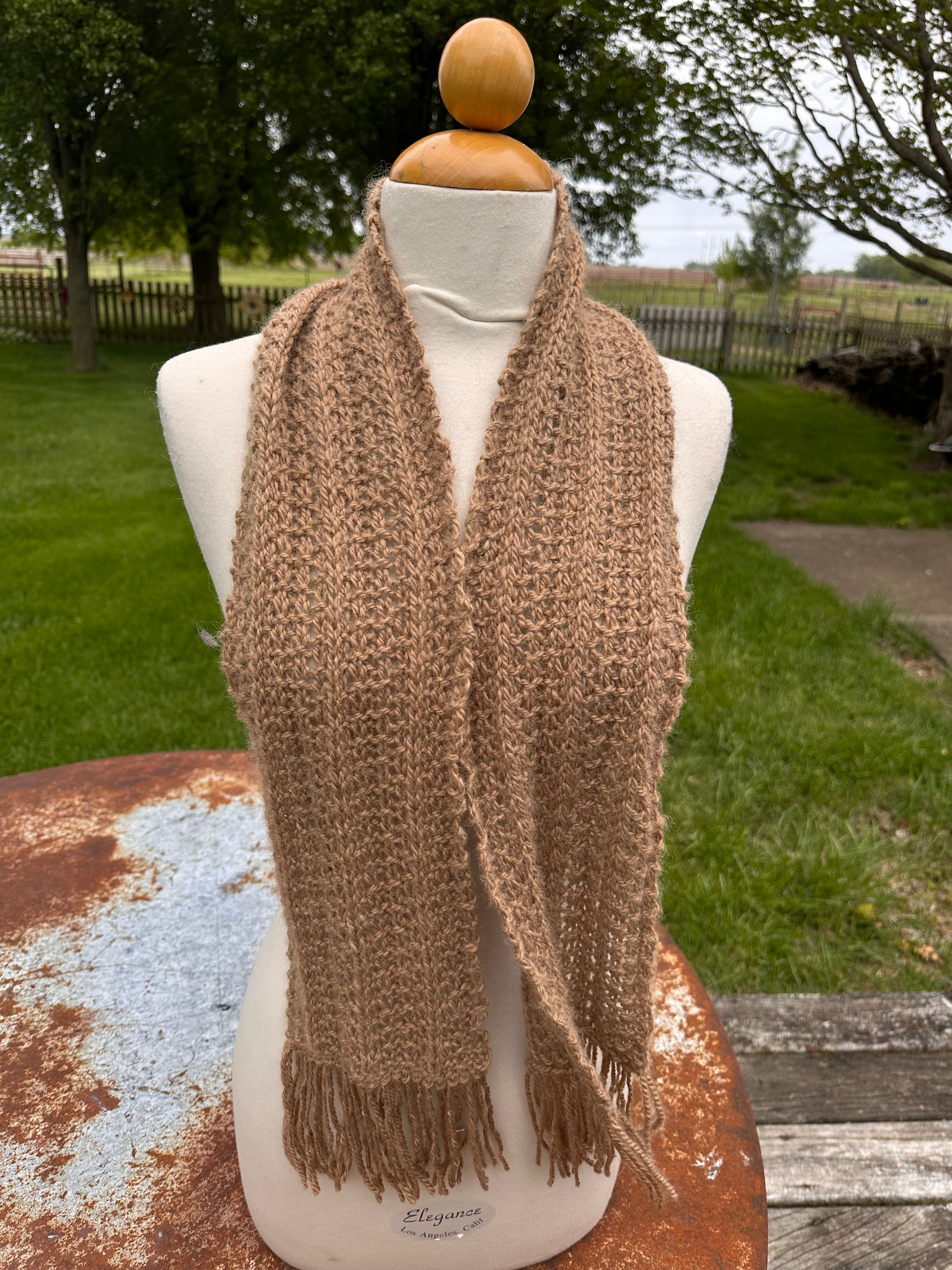 100% USA Alpaca hand knit scarf. Very soft and warm.