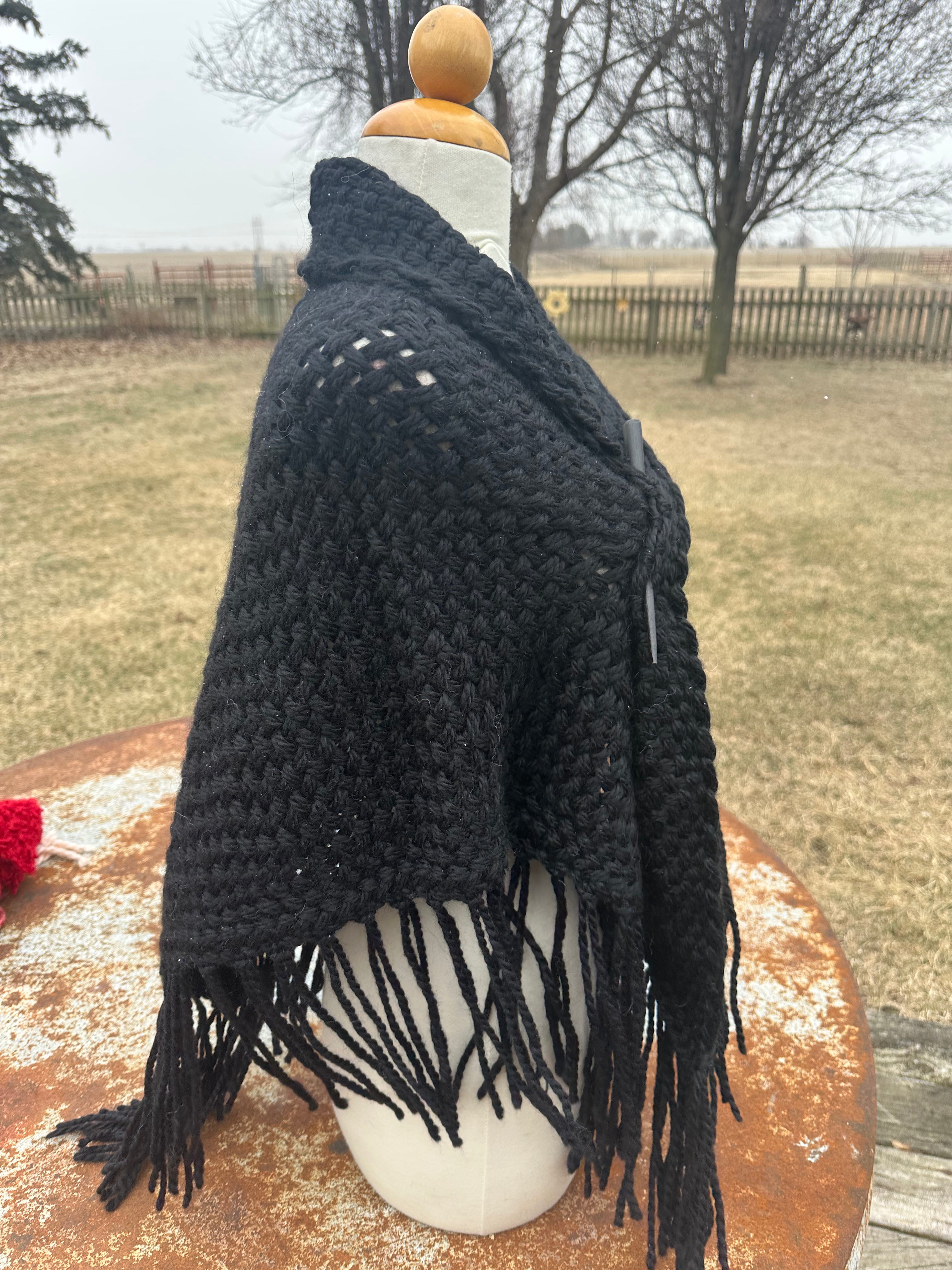 100% Alpaca hand woven shawl with fringe. Very soft and warm.