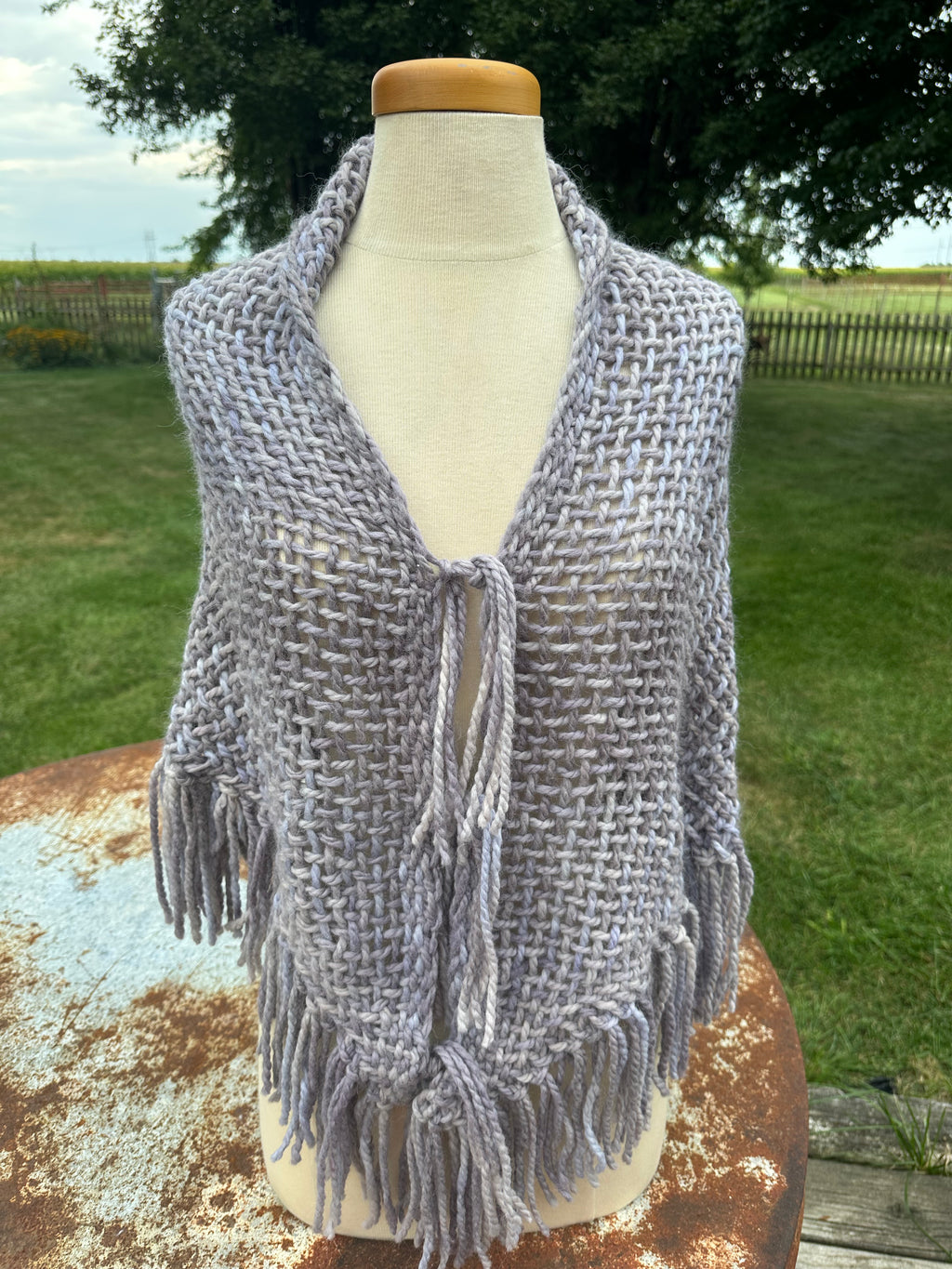100% Alpaca hand woven shawl with fringe. Very soft and warm.