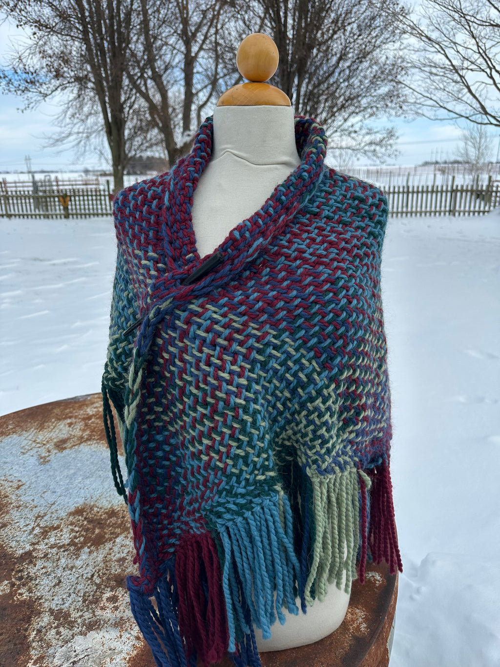 100% Alpaca hand woven shawl with fringe. Very soft and warm.