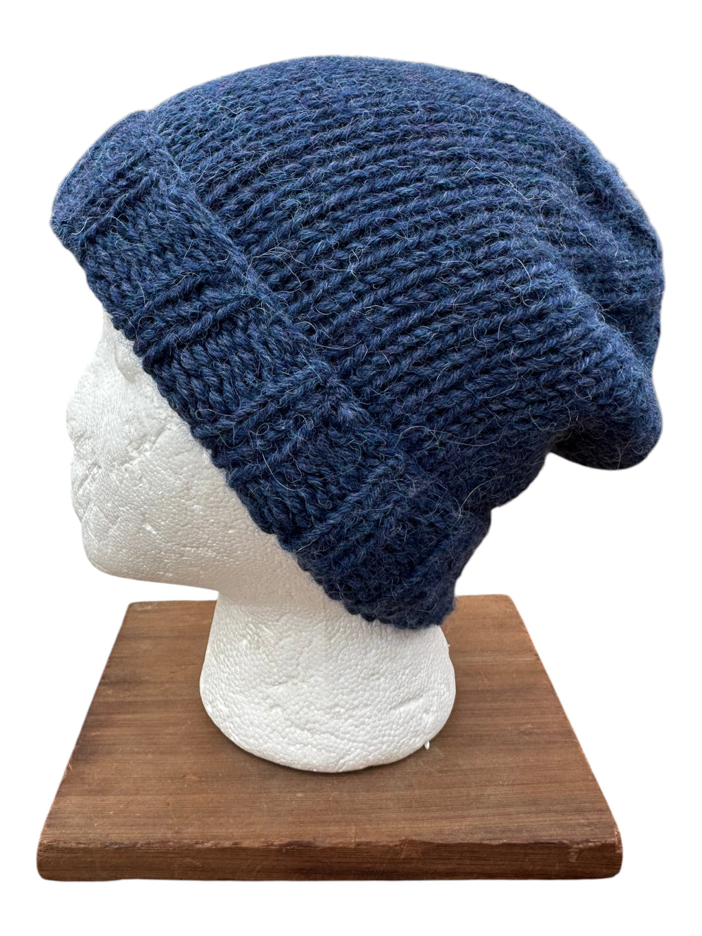 Oak Crest Alpacas and More hand-knit blue chunky alpaca wool beanie with a folded brim on a mannequin head
