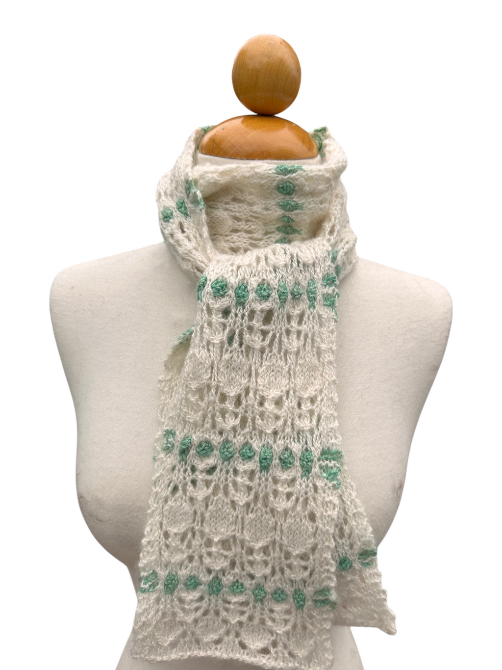 Oak Crest Alpacas and More hand knit white and green lace alpaca scarf on a mannequin