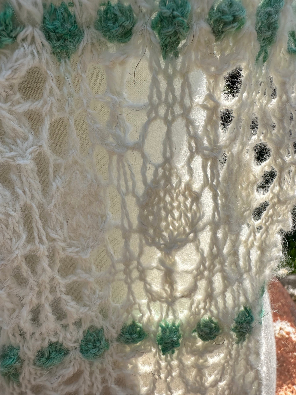 100% USA Alpaca hand knit scarf. Delicate lacey pattern.