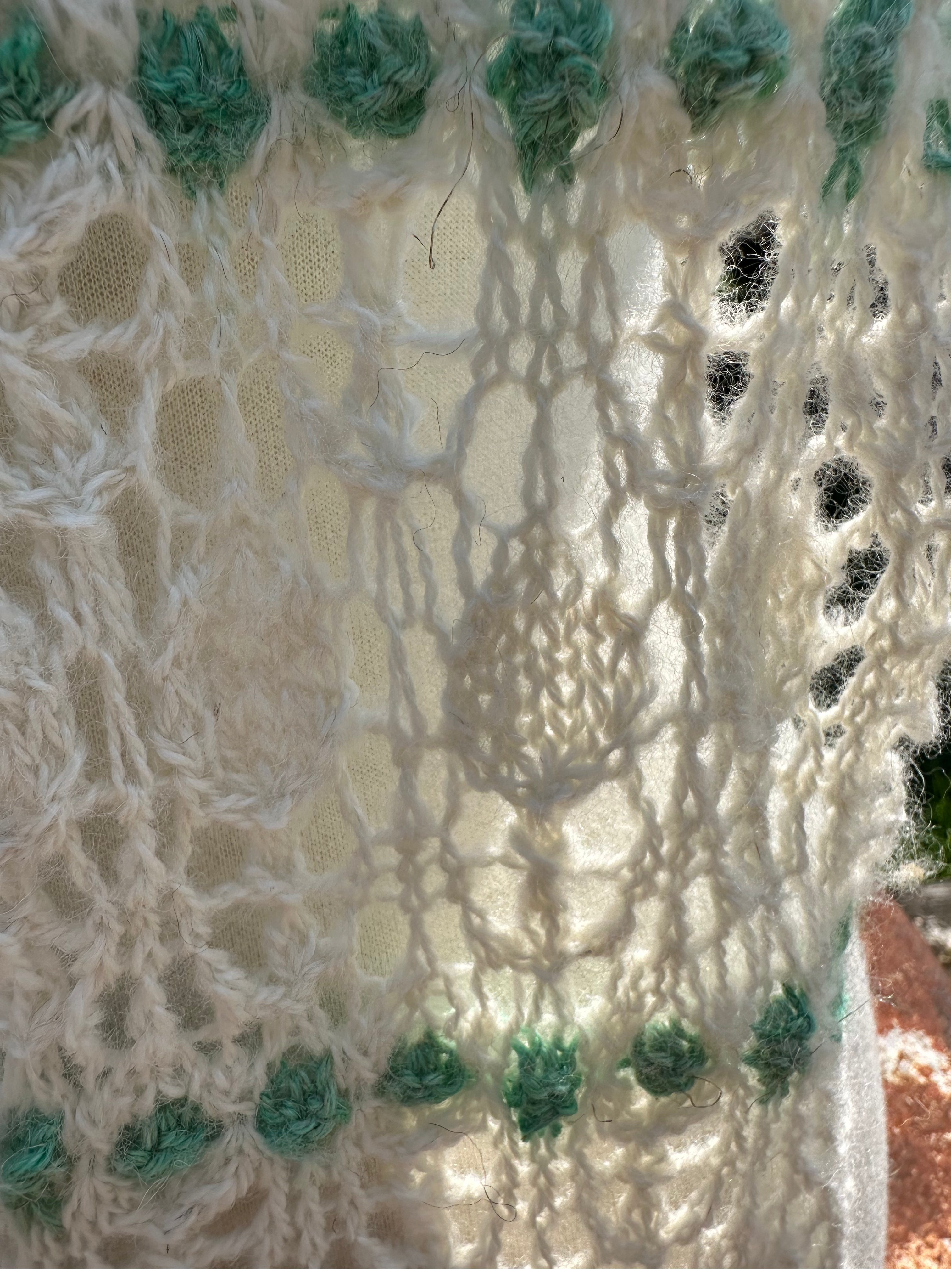 100% USA Alpaca hand knit scarf. Delicate lacey pattern.