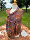 100% Alpaca hand woven shawl with fringe. Very soft and warm.