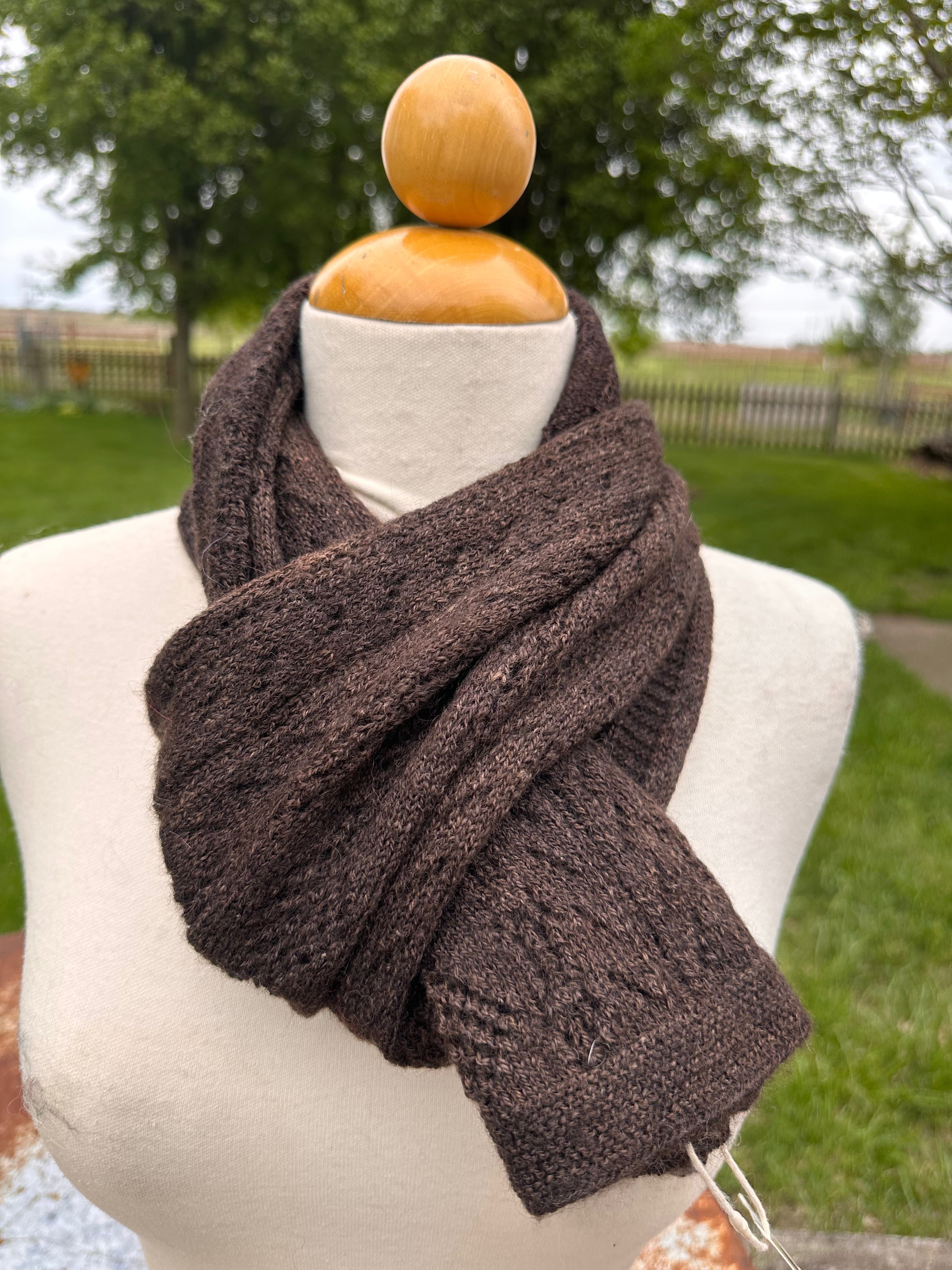 100% USA Alpaca machine knit scarf. Very soft and warm.