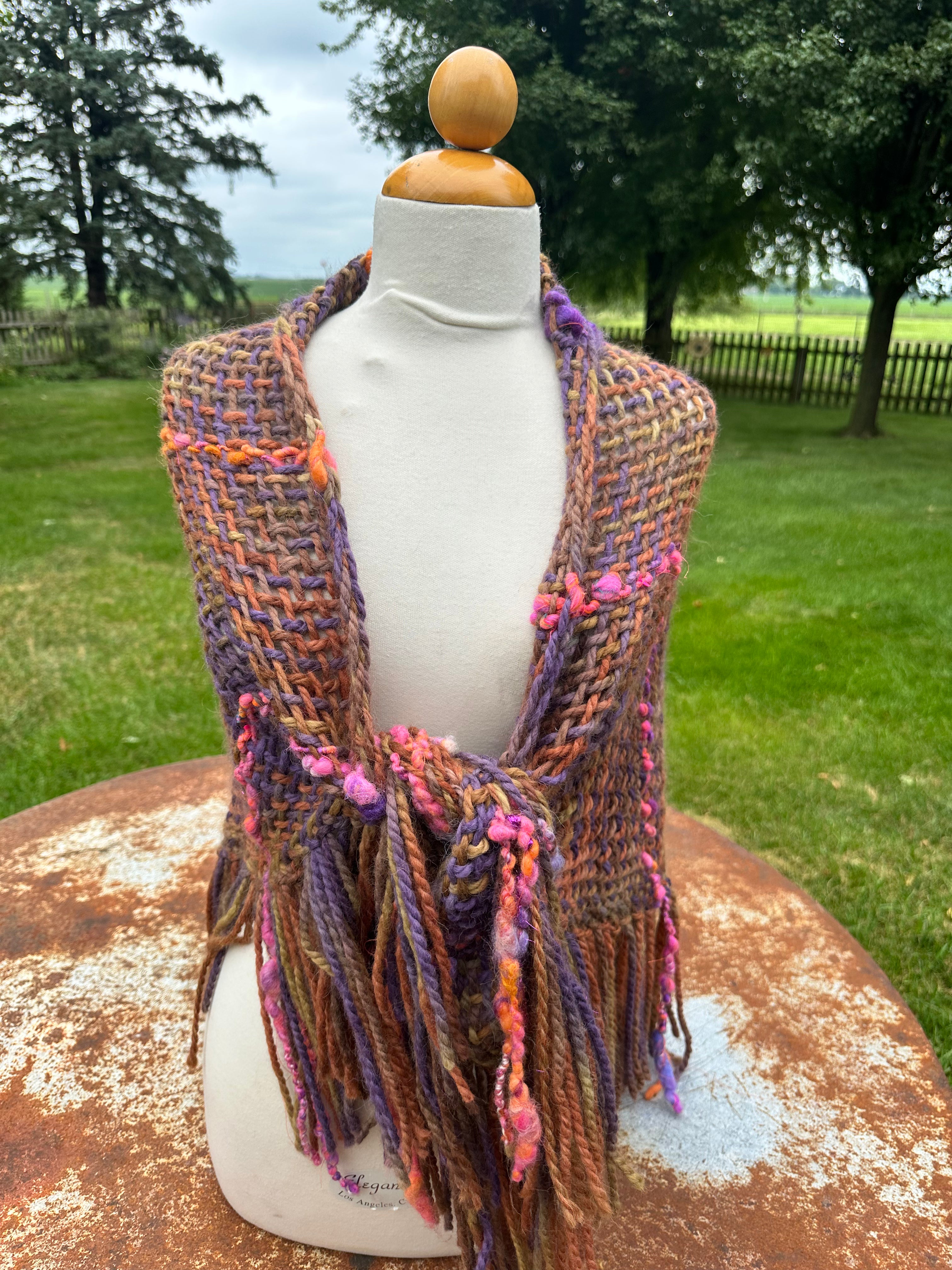 100% Alpaca hand woven shawl with fringe. Very soft and warm.