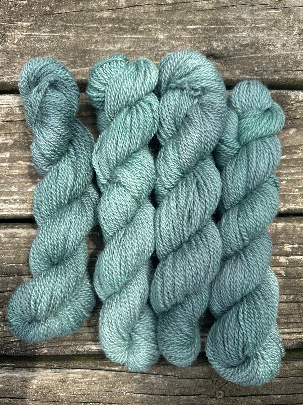 150 yd of Worsted weight 100%  American Alpaca yarn, 2 ply, from our alpacas. Hand dyed.