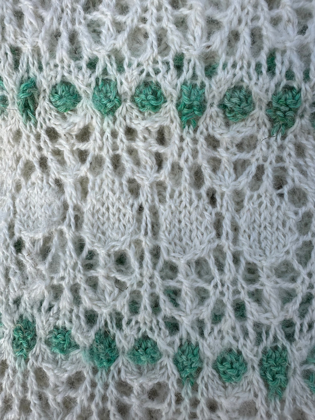 100% USA Alpaca hand knit scarf. Delicate lacey pattern.