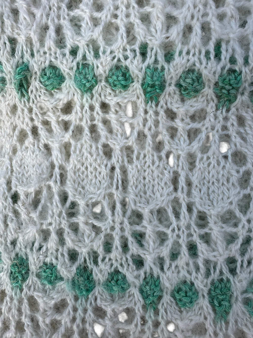 Oak Crest Alpacas and More hand knit alpaca scarf featuring a delicate white and green lace pattern