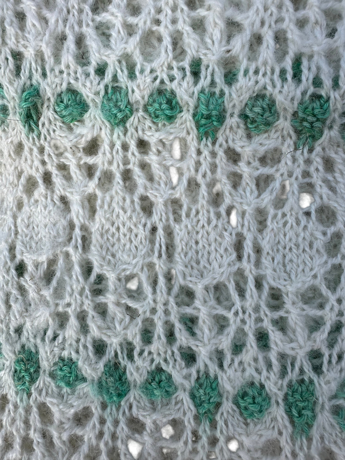 Oak Crest Alpacas and More hand knit alpaca scarf featuring a delicate white and green lace pattern
