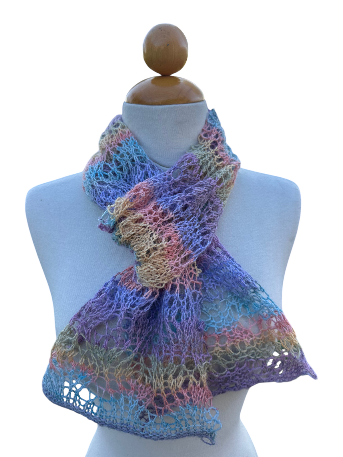 Oak Crest Alpacas and More hand knit pastel alpaca and rayon lacey scarf on a mannequin in an outdoor setting