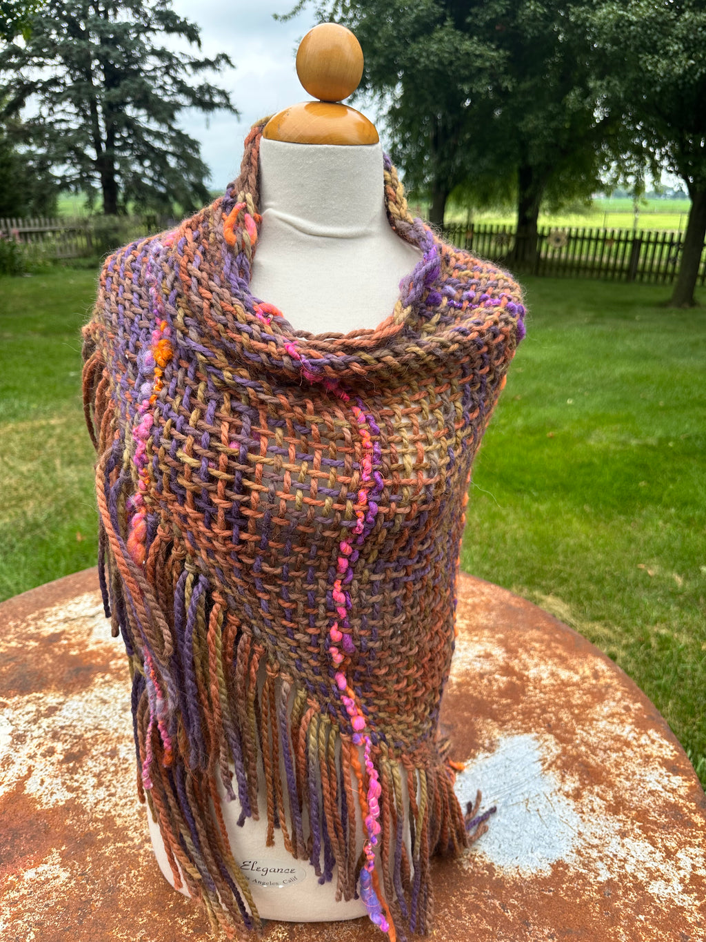 100% Alpaca hand woven shawl with fringe. Very soft and warm.