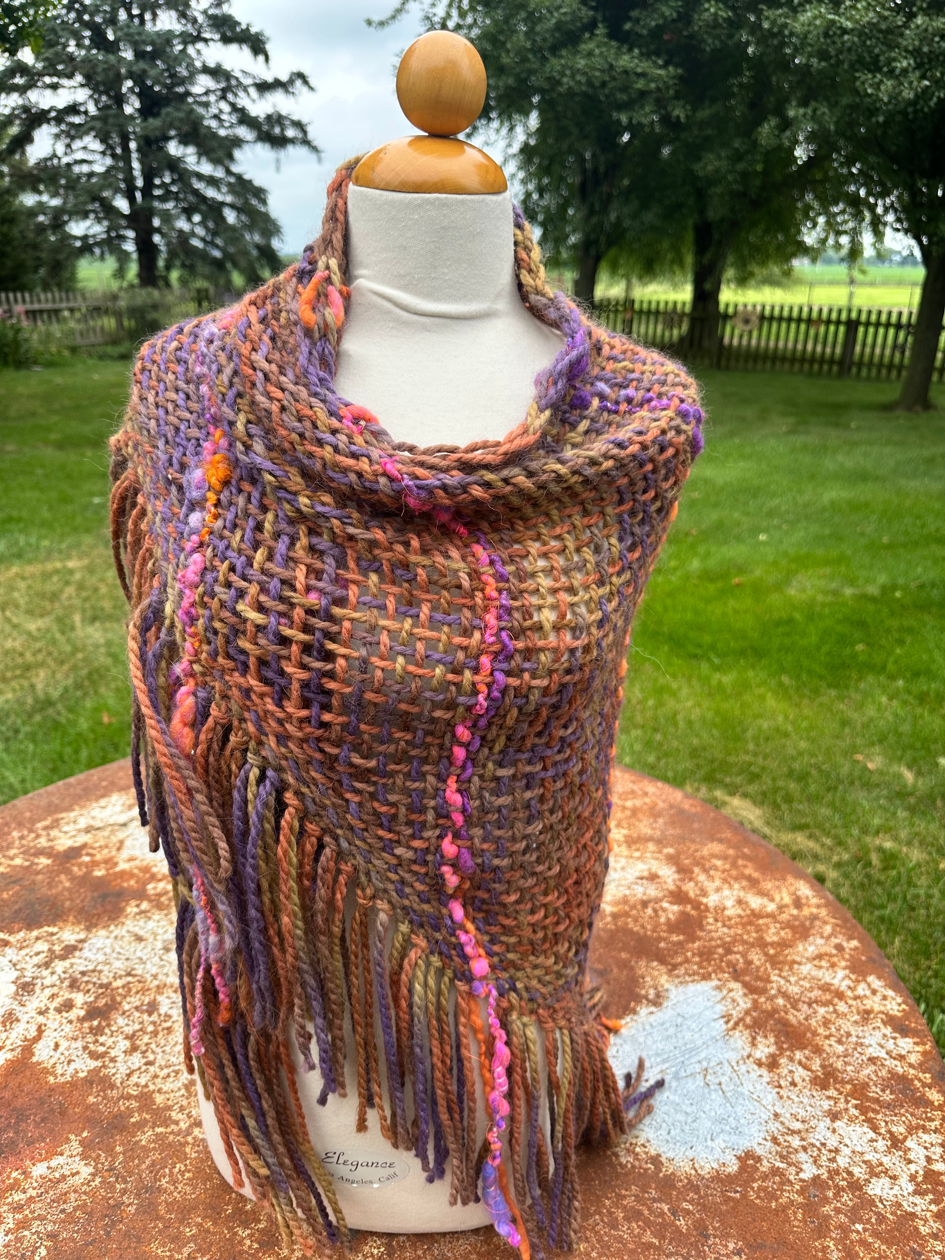 100% Alpaca hand woven shawl with fringe. Very soft and warm.