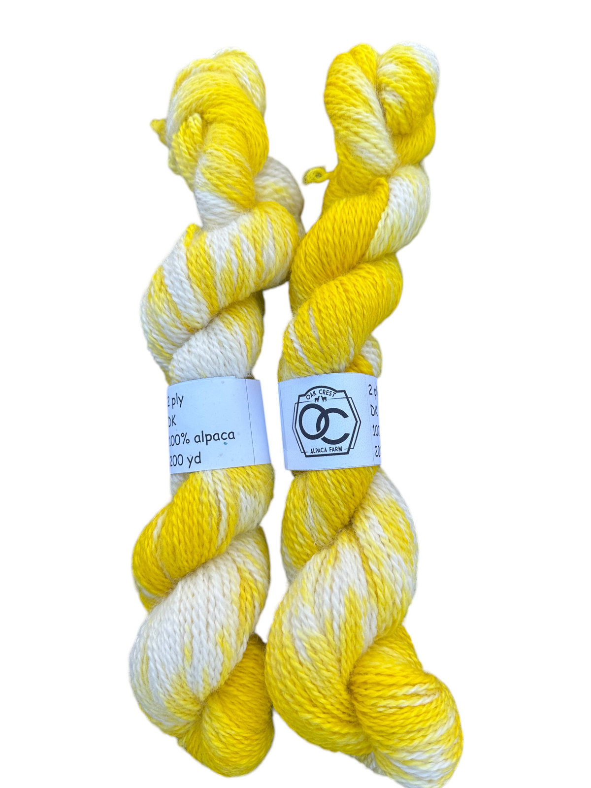 Oak Crest Alpacas and More hand-dyed yellow and white 100% alpaca DK yarn skeins with 2-ply dehaired fiber.