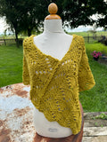 Hand knit Llama poncho/wrap. One size fits all.