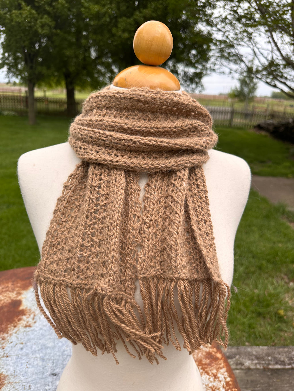 100% USA Alpaca hand knit scarf. Very soft and warm.