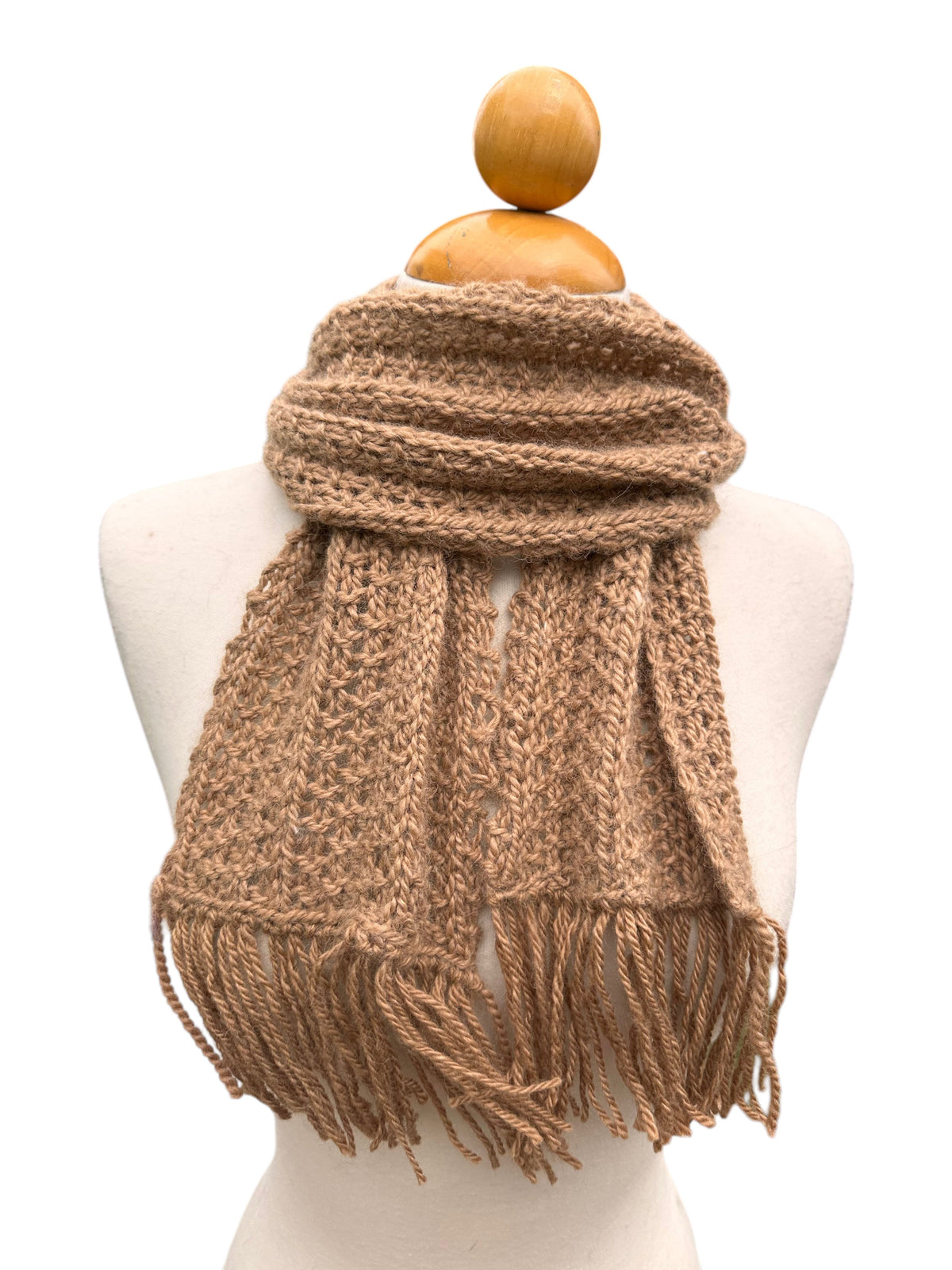 Oak Crest Alpacas and More hand knit tan alpaca wool scarf with fringe detail on a mannequin