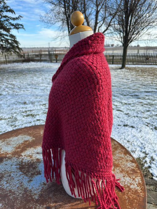 100% Alpaca hand woven shawl with fringe. Very soft and warm.