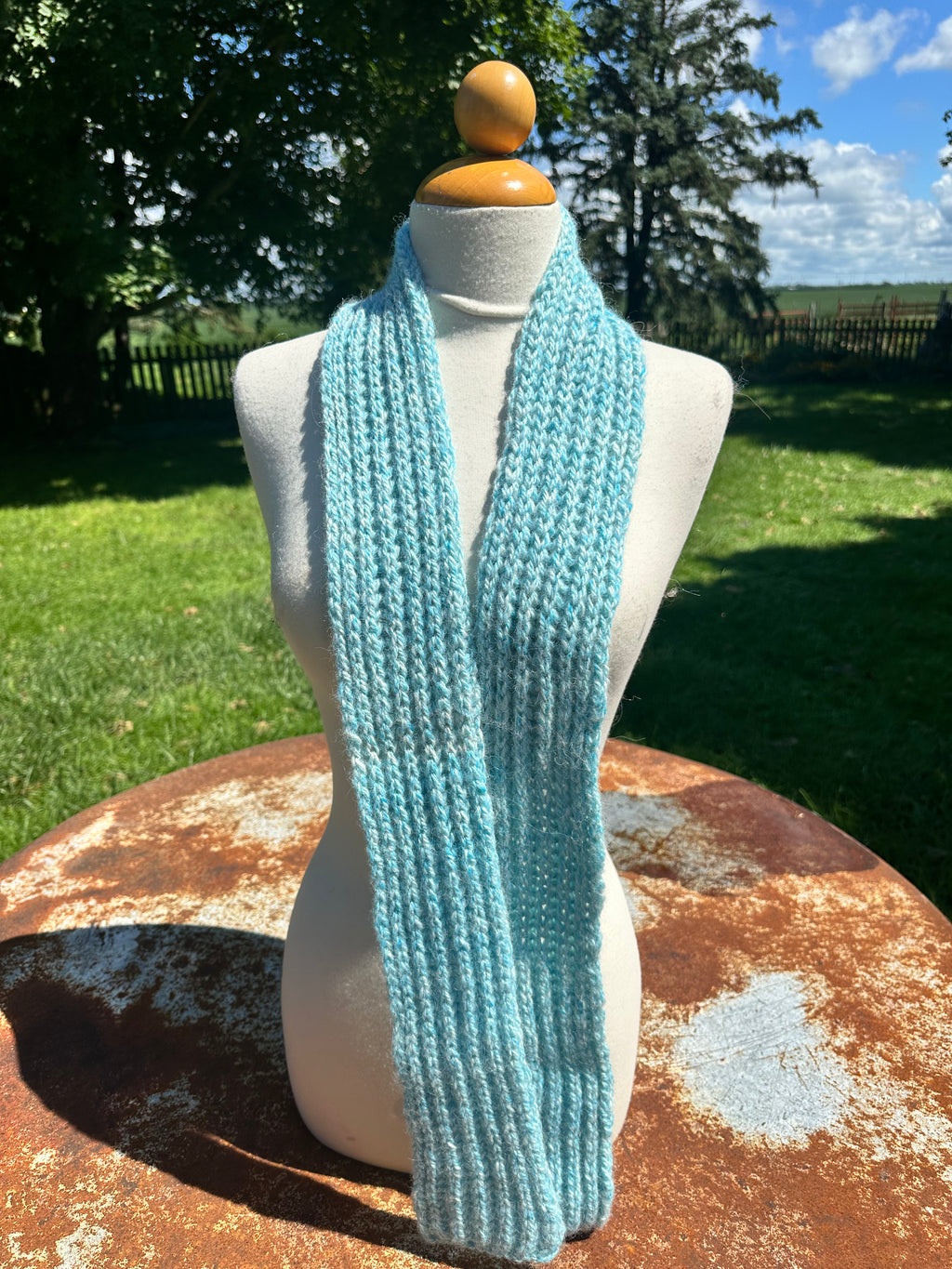 100% USA Alpaca hand knit scarf. Very soft and warm.