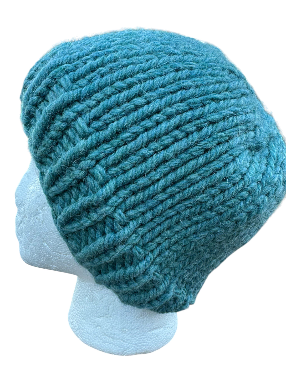 Oak Crest Alpacas and More chunky knit teal alpaca and wool beanie on a mannequin head outdoors