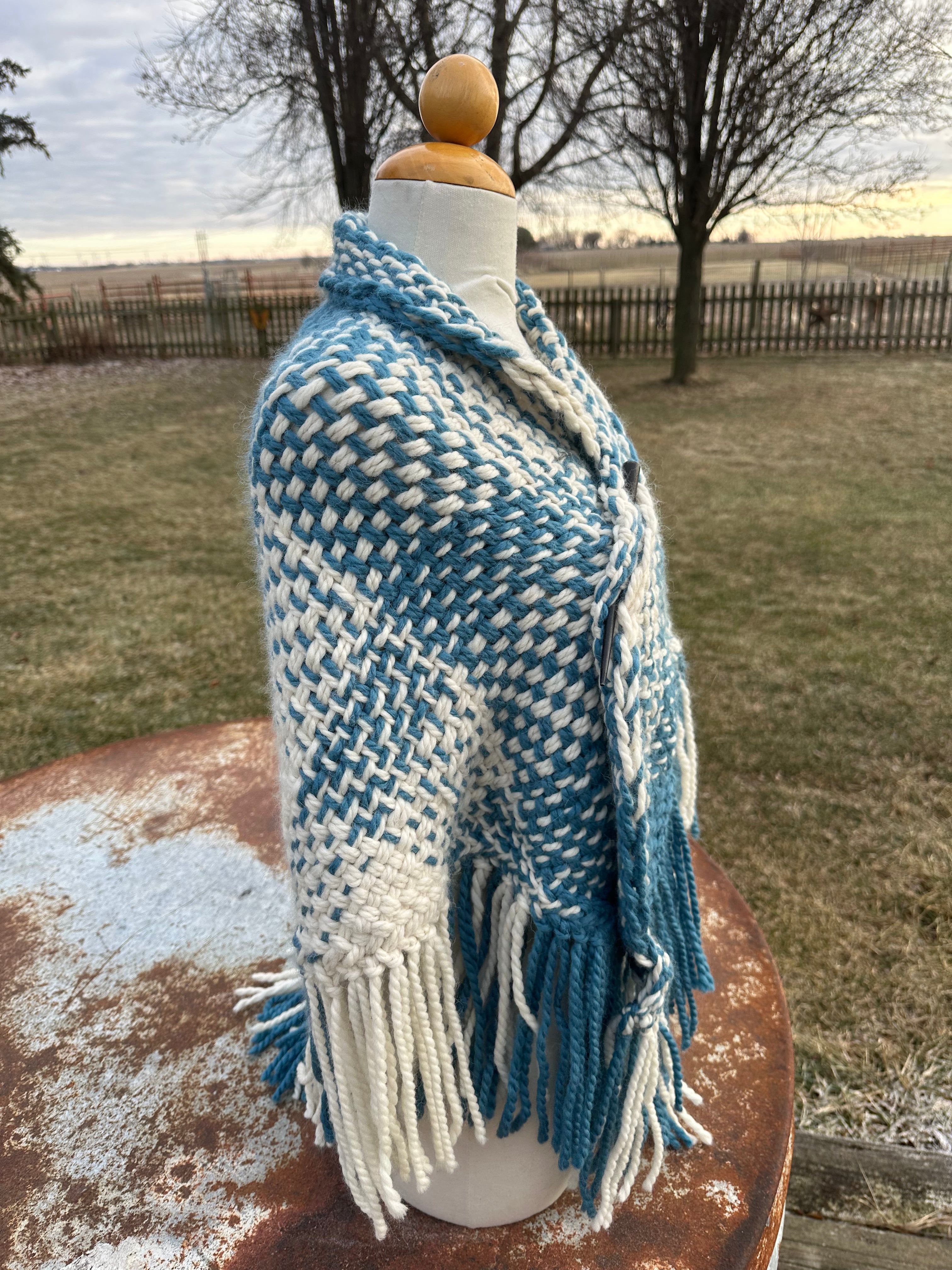 100% Alpaca hand woven shawl with fringe. Very soft and warm.